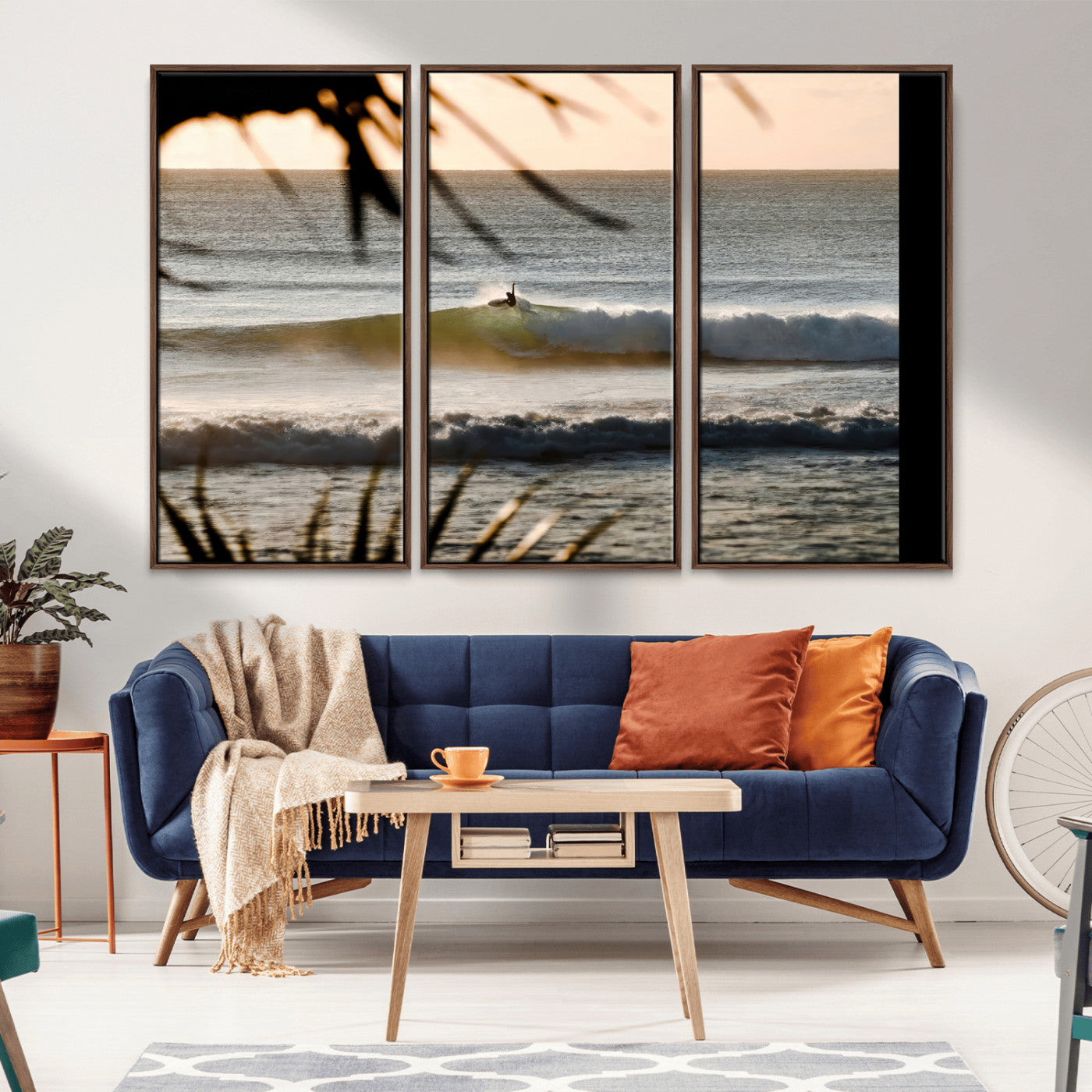 Photo of a surfer riding a golden hour wave at sunset, with tropical tones and dreamy light, perfect for tropical boho or coastal home decor.
