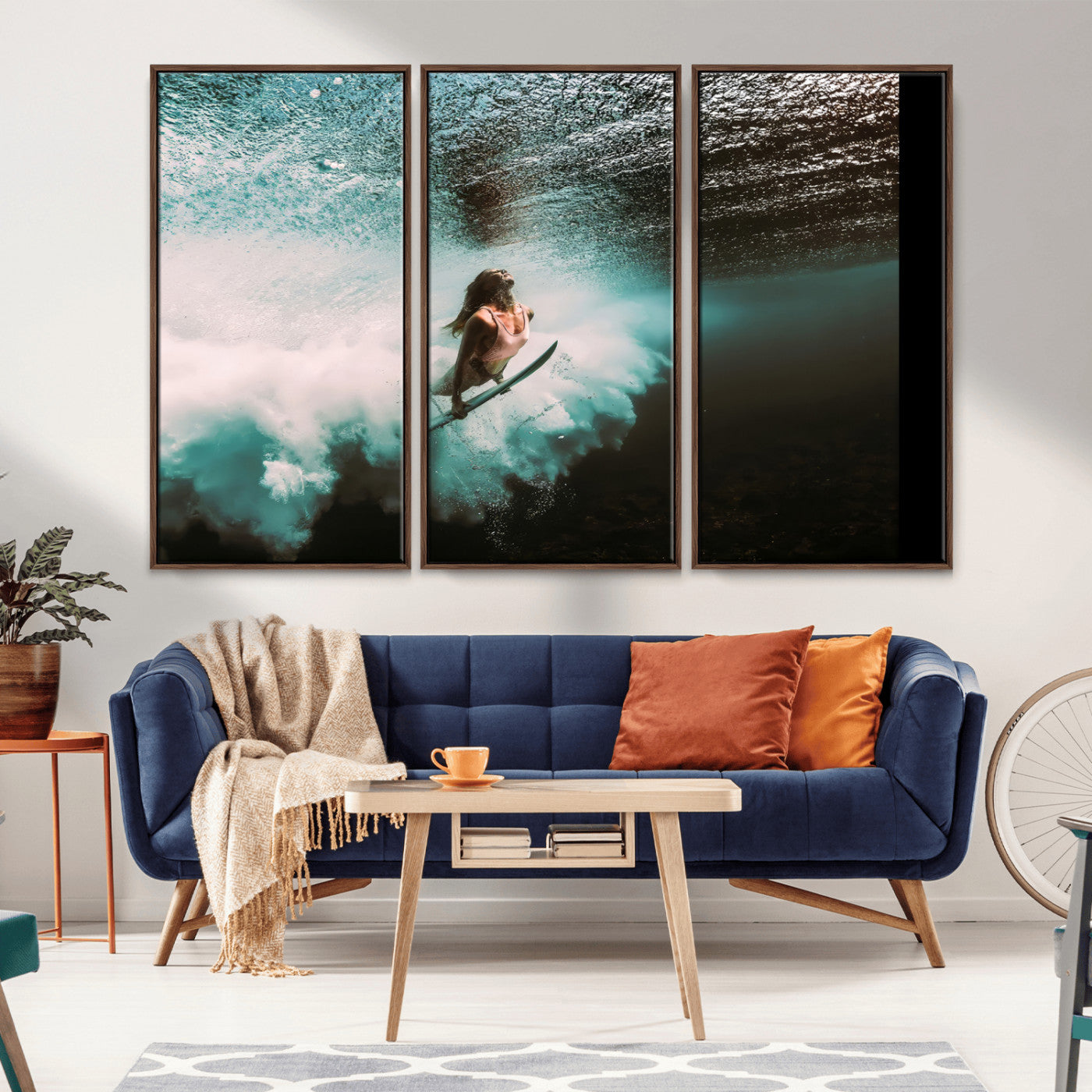 Vibrant underwater photo of a female surfer diving through turquoise waves, perfect for coastal boho or surf-inspired home decor.