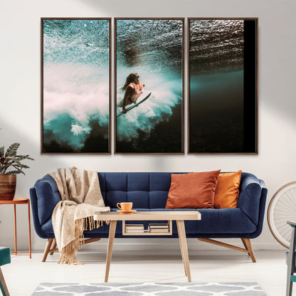 Vibrant underwater photo of a female surfer diving through turquoise waves, perfect for coastal boho or surf-inspired home decor.
