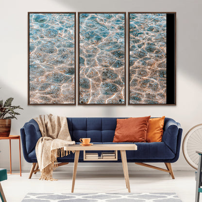 Close-up of sunlit ocean ripples with aqua blue and golden tones, ideal for modern coastal or minimalist home decor.