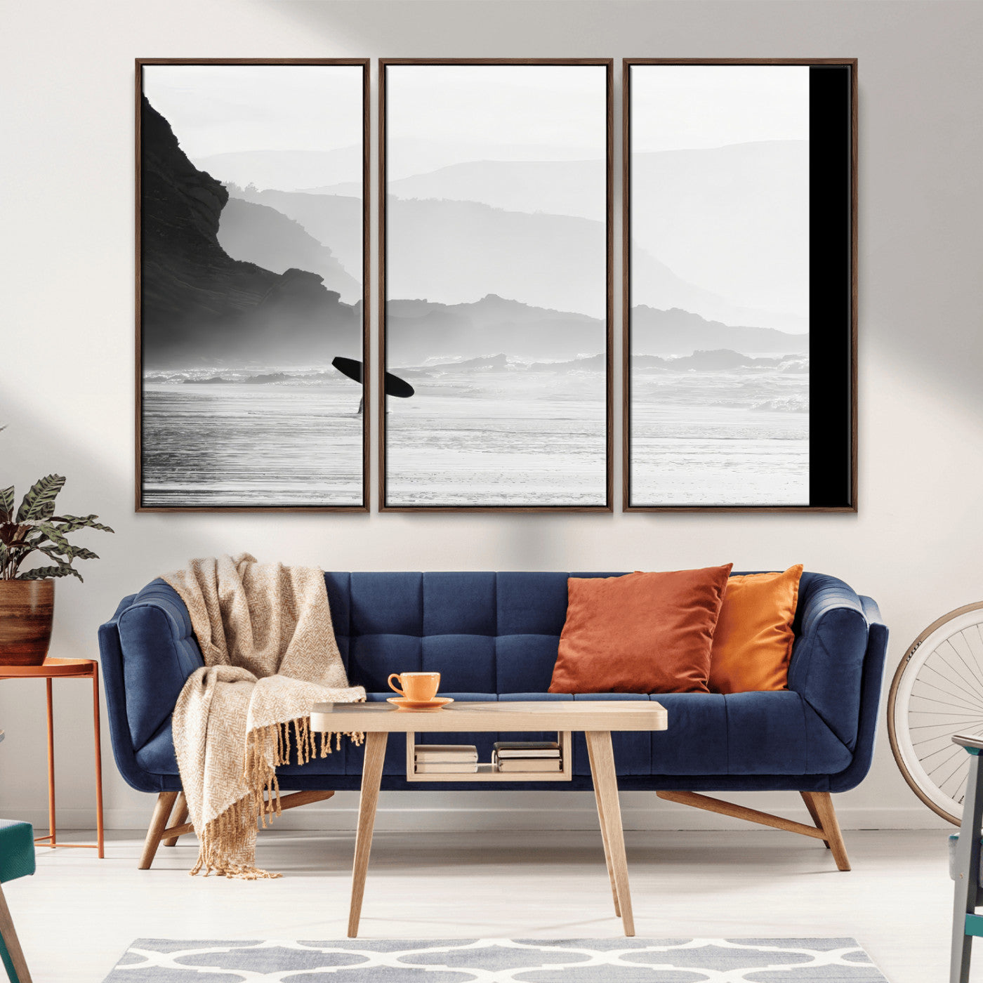 A lone surfer walking along a misty beach with cliffs in the background, carrying their board, capturing a serene and minimal ocean moment.