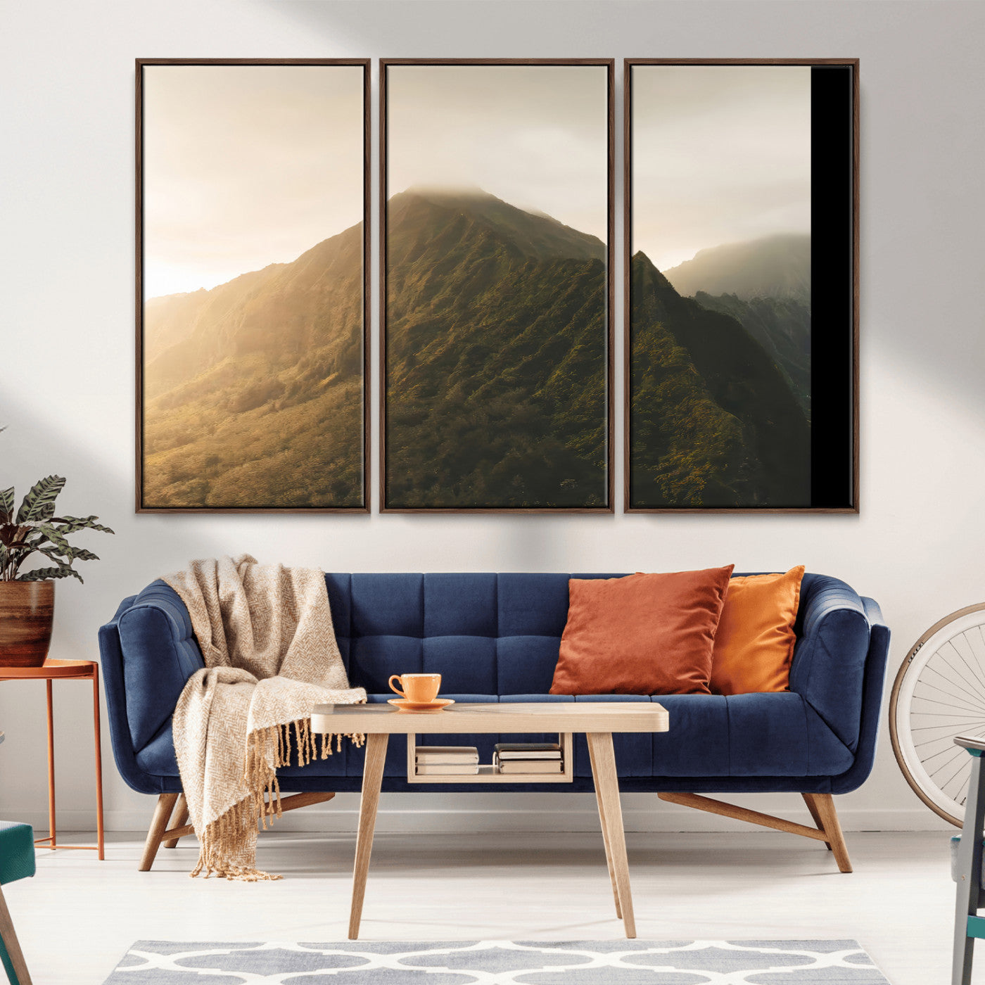 Sunlit mountain peak with mist rolling over its rugged slopes, bathed in golden light, creating a warm and tranquil nature-inspired scene.