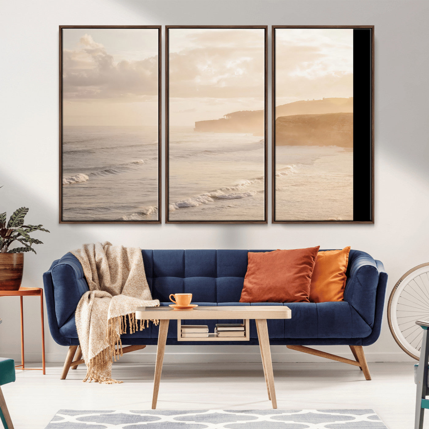 Golden hour seascape with misty cliffs and gentle waves rolling towards the shore, capturing a tranquil and warm coastal atmosphere.