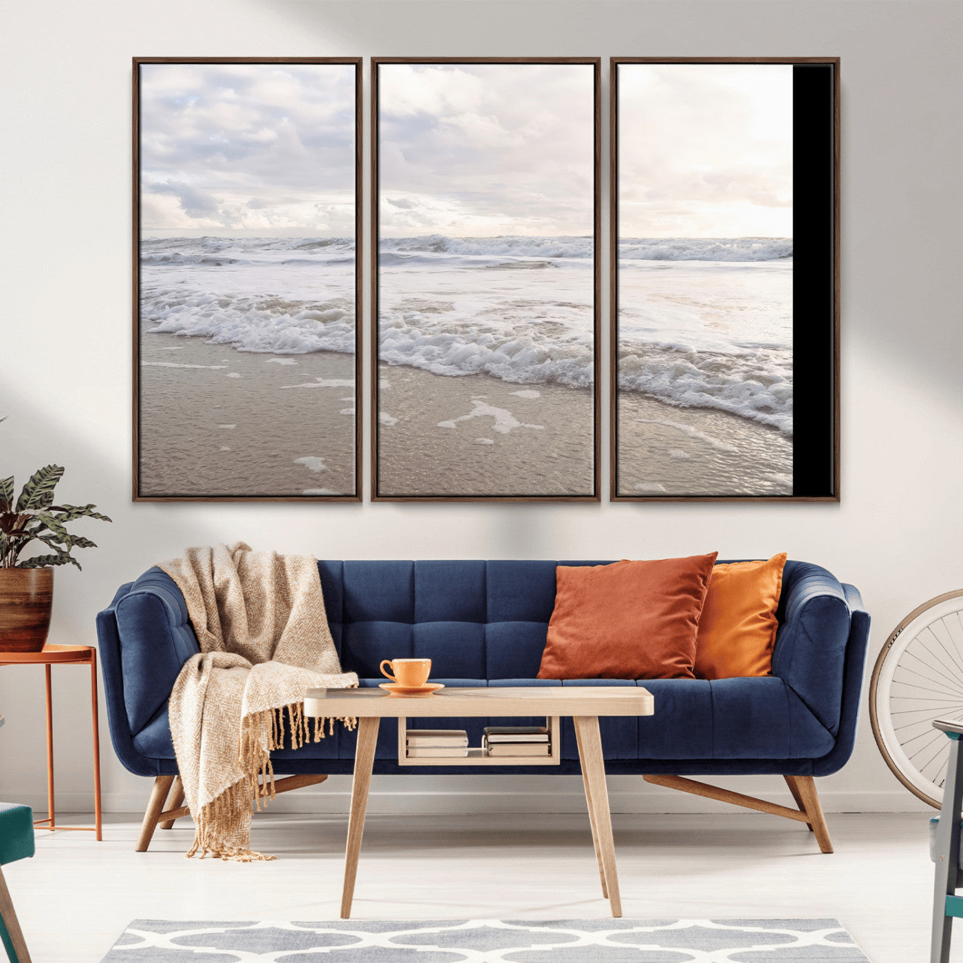Peaceful ocean waves rolling onto the sandy shore under soft light, perfect for neutral or coastal minimalist decor themes.