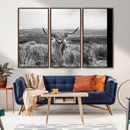 A black and white portrait of a Highland cow in a foggy Scottish countryside, capturing a rustic aesthetic and tranquil farm escape.