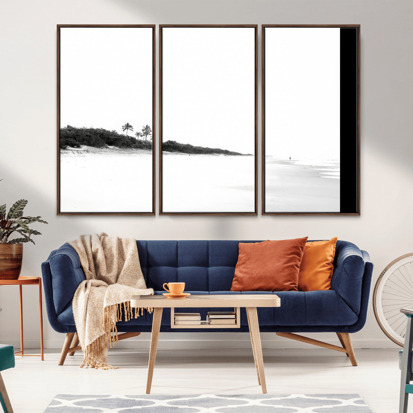 A black and white minimalist coastal scene with a vast open beach, distant palm trees, and a lone figure walking along the shoreline, evoking serenity and solitude.