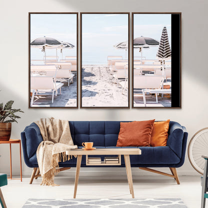 A serene minimalist beach scene featuring striped umbrellas, soft pastel sand, and an elegant lounge setup, creating a tranquil and stylish coastal retreat.
