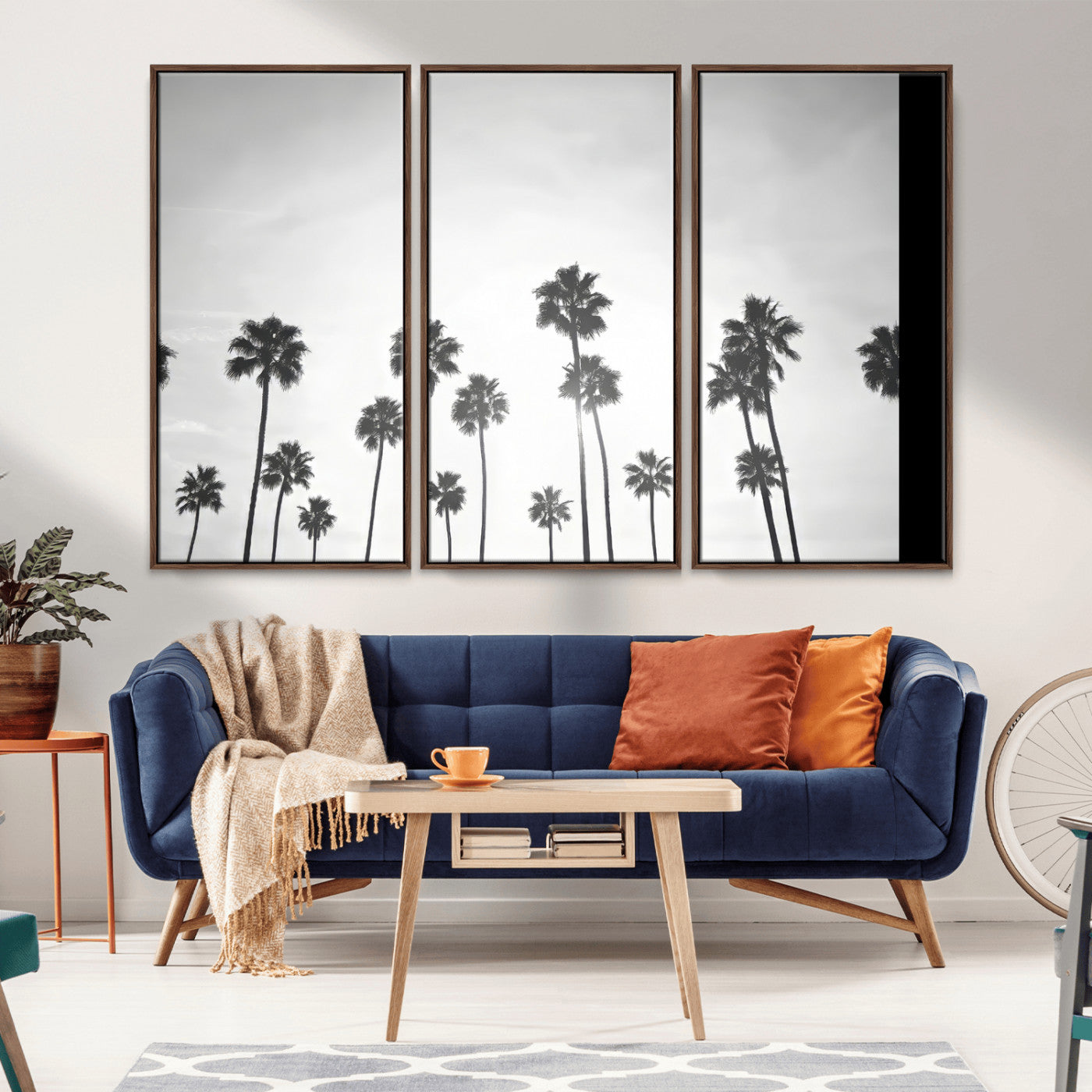 A black and white minimalist scene featuring tall palm trees silhouetted against a bright sky, creating a dreamy and timeless tropical aesthetic.