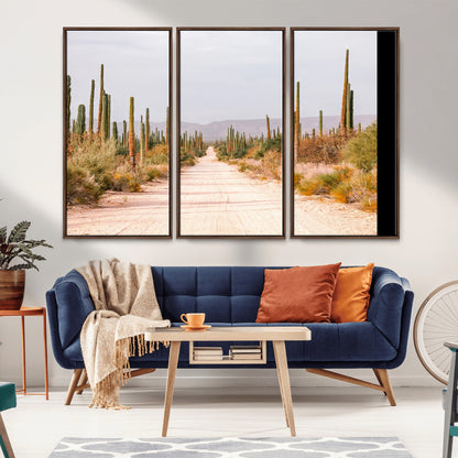A desert road lined with saguaro cacti under a golden sky, creating a warm southwestern feel, perfect for boho or rustic decor.