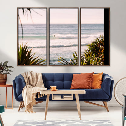 Canvas of a lone surfer riding a pastel wave at sunrise, perfect for tropical or coastal-themed spaces with a relaxed, airy vibe.