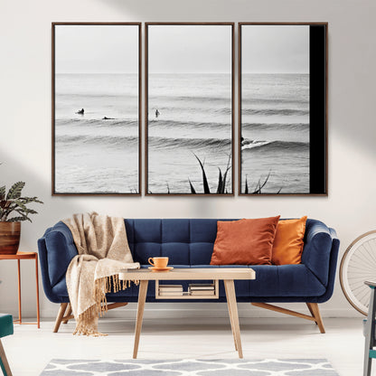 Monochrome canvas of surfers on calm ocean waves, ideal for minimalist coastal or beach-inspired interior decor.