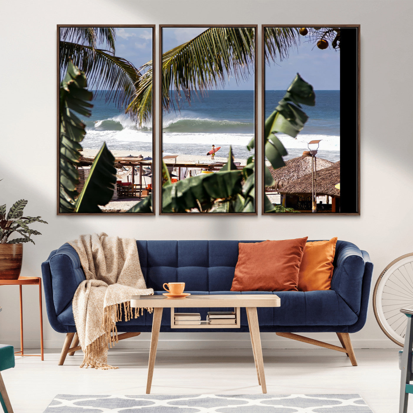 Canvas wall art of a tropical surf scene framed by palm trees, with a surfer on the shore and waves rolling in, ideal for beach-themed decor.