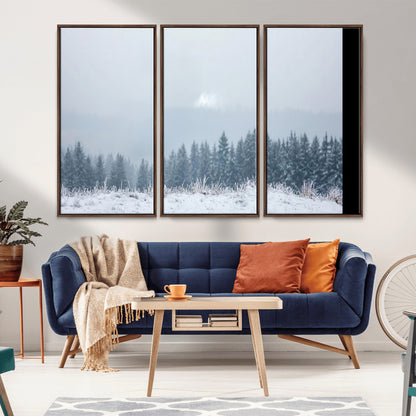 Snow-covered forest under misty sky, soft light breaking through clouds, ideal for minimalist or Nordic-inspired home decor.