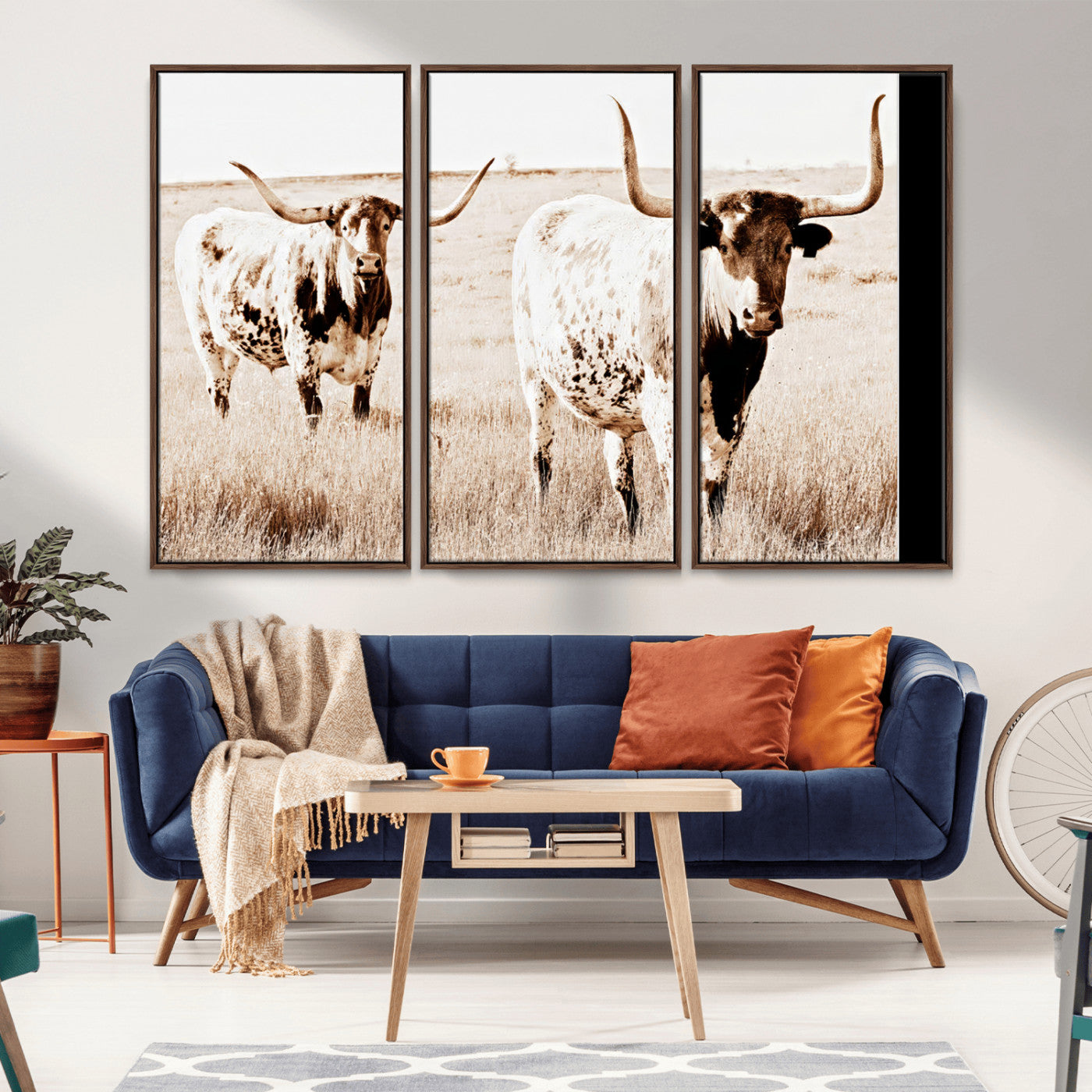 Two Texas longhorn cows standing in a sepia-toned pasture, evoking rustic charm perfect for farmhouse or western country interiors. (
