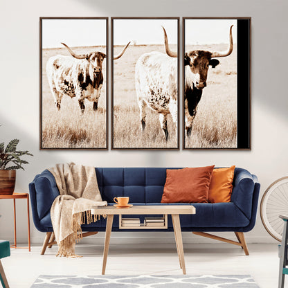 Two Texas longhorn cows standing in a sepia-toned pasture, evoking rustic charm perfect for farmhouse or western country interiors. (