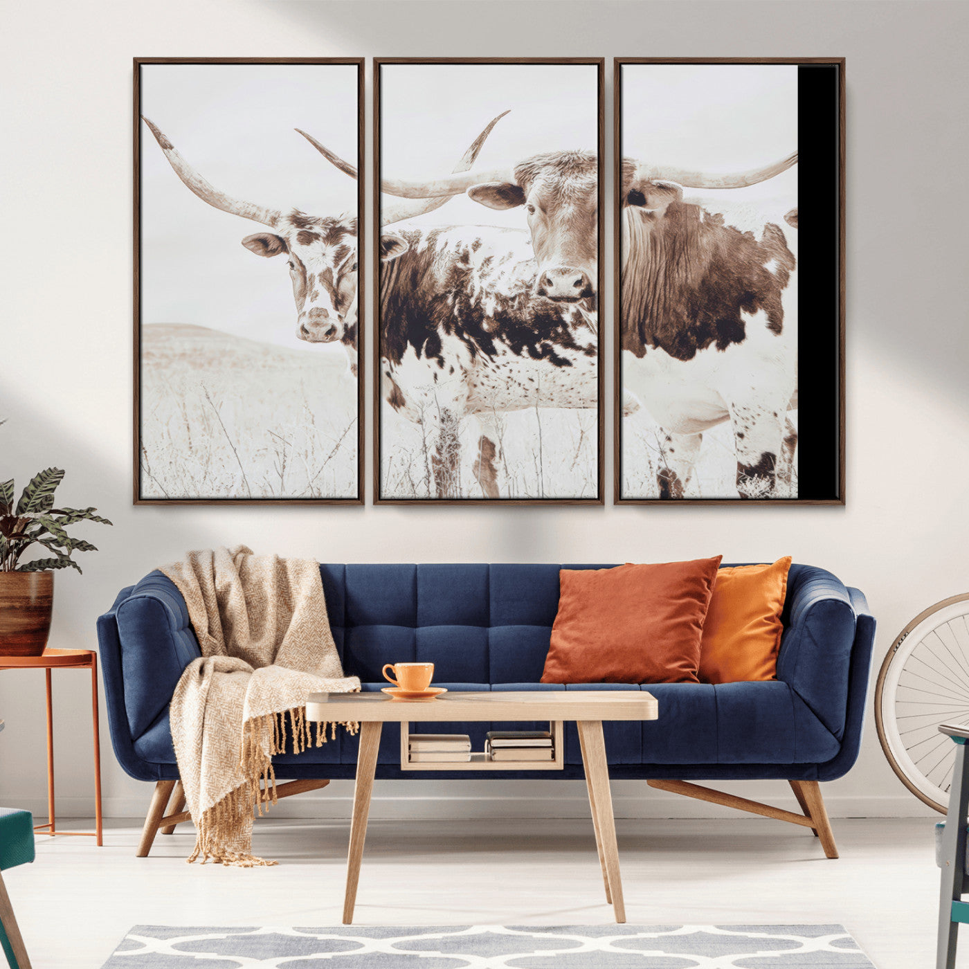 Two longhorn cows standing in a sepia-toned pasture with soft light, ideal for rustic or farmhouse-themed neutral wall decor.