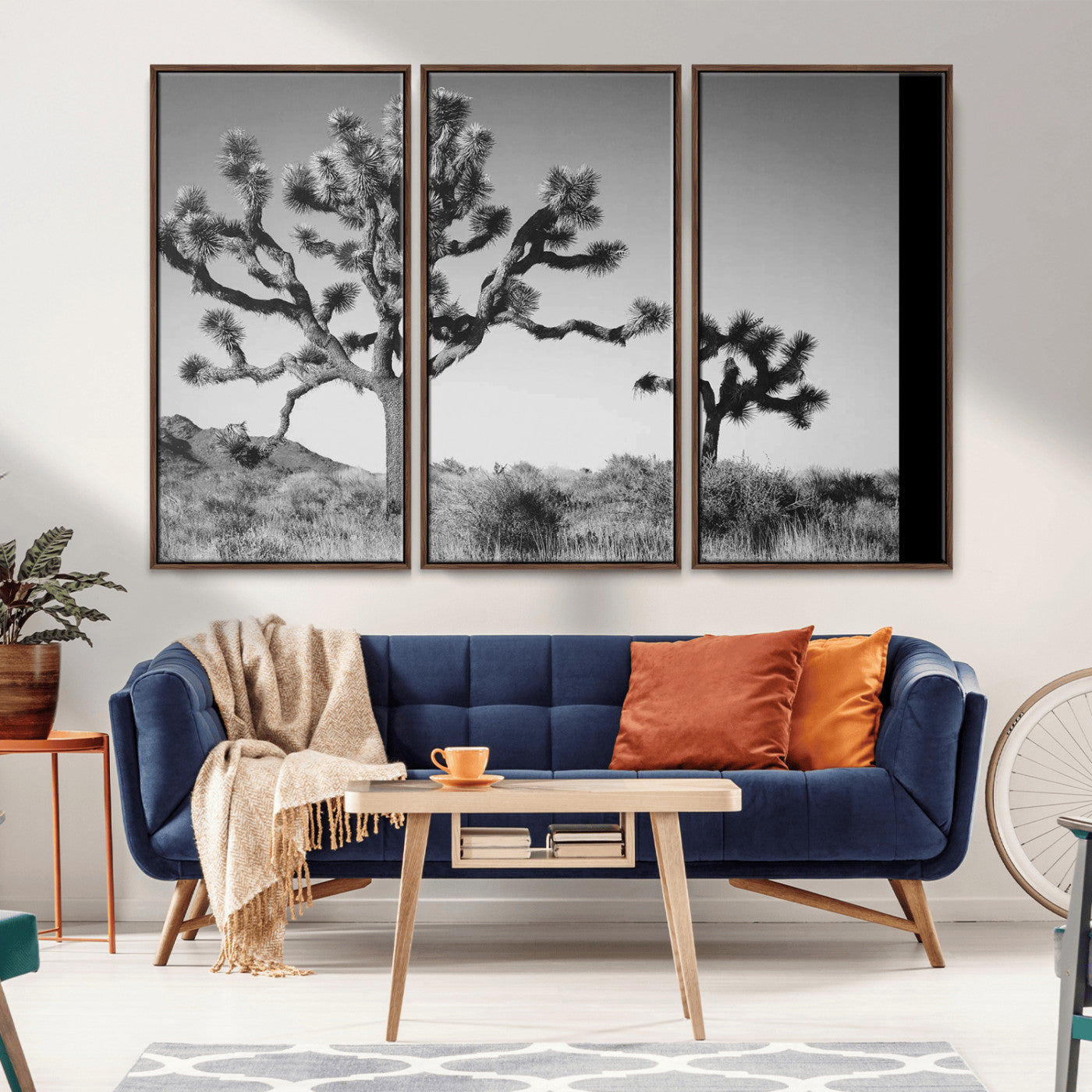 Black and white Joshua trees in a rugged desert landscape, creating a calm and minimalist feel for natural or rustic-themed interiors.