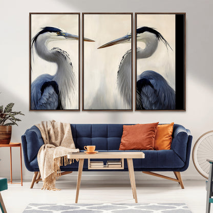 Two blue herons facing each other on a soft neutral background, ideal for coastal, tranquil, or nature-inspired minimalist interiors.