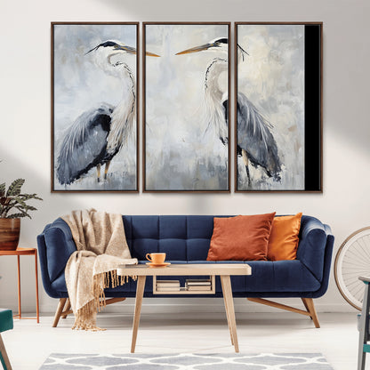Two herons facing each other on a soft-toned background with blue-grey feathers, perfect for tranquil, coastal or nature-themed interiors.