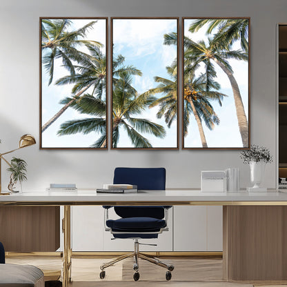 Framed canvas of tall palm trees reaching into a tropical sky, ideal for beach home or relaxed island-inspired wall decor.