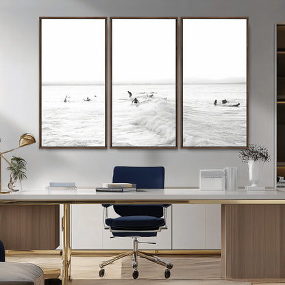 Monochrome photo of surfers riding and waiting on ocean waves, ideal for surf-themed or coastal energy wall decor.