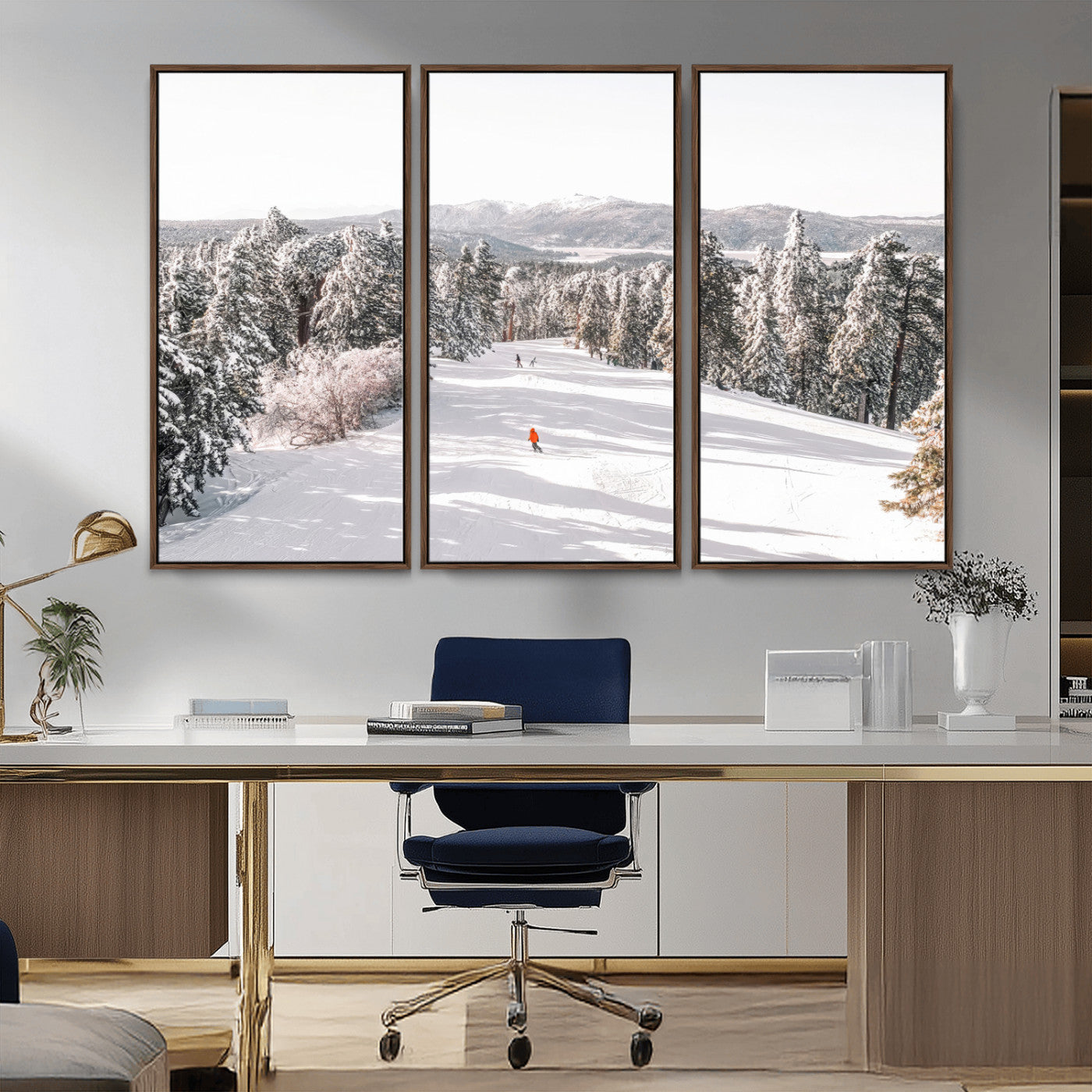 Bright ski trail lined with snow-covered pines and a skier in orange, perfect for alpine adventure or winter sports-inspired decor.