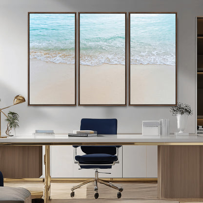 Soft shoreline with gentle aqua waves on smooth sand, ideal for minimalist coastal or pastel ocean-inspired home wall decor.