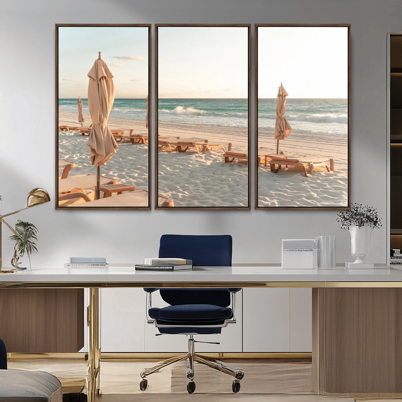 Minimalist photo of empty beach loungers and umbrellas on soft sand, ideal for calm seaside or pastel coastal-style home decor.
