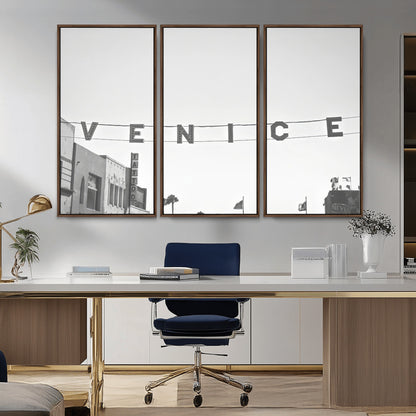 Black and white photo of Venice Beach sign and palm-lined street, perfect for urban coastal or minimalist LA-inspired wall decoration.