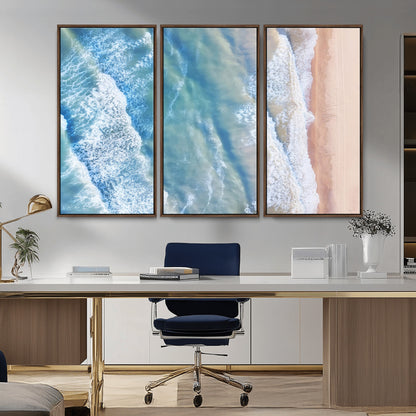 Aerial photo of soft blue waves meeting sandy shore, perfect for modern coastal or beach-themed decor with a light and tranquil aesthetic.