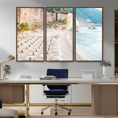 Wall art of a calm Mediterranean beach with rows of sun loungers and umbrellas in soft pastel tones, perfect for light coastal or vacation-themed decor.