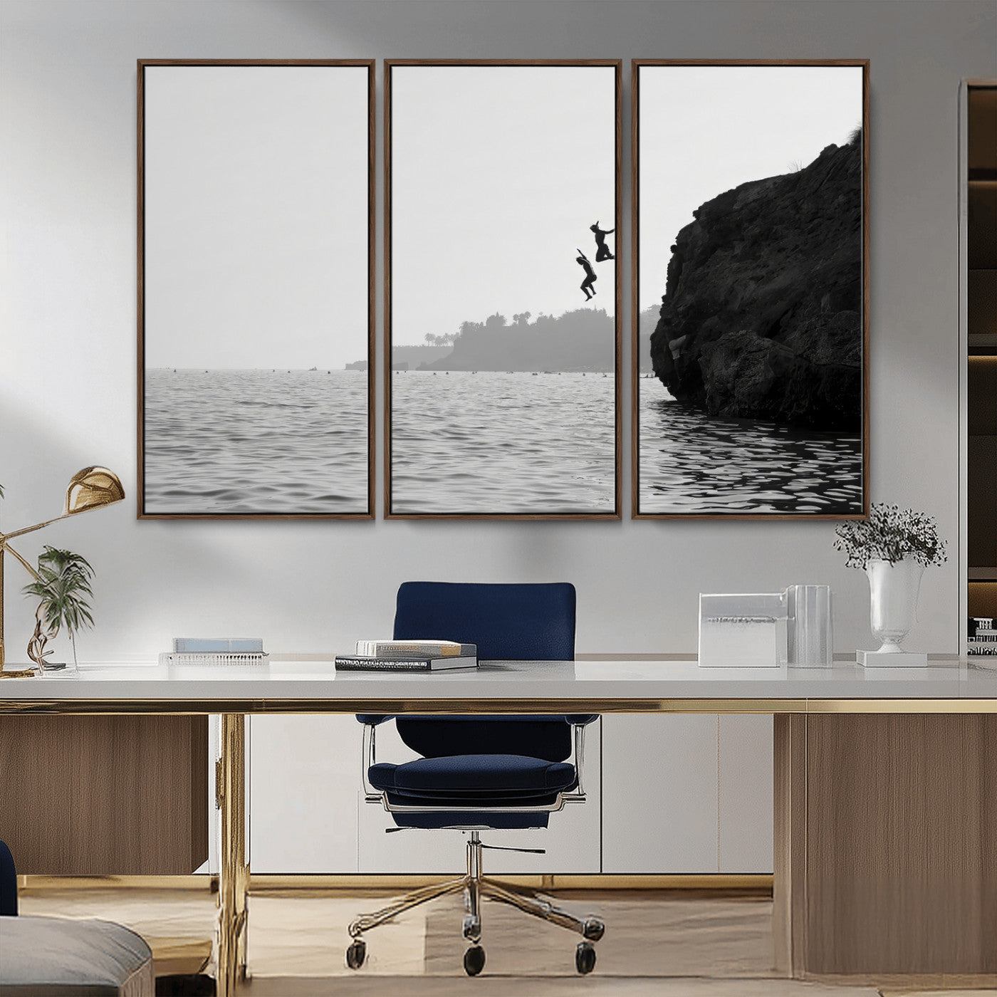 Black and white canvas of two figures cliff jumping into the sea, captured with moody tones, ideal for modern coastal or adventure-themed home decor.   2/2