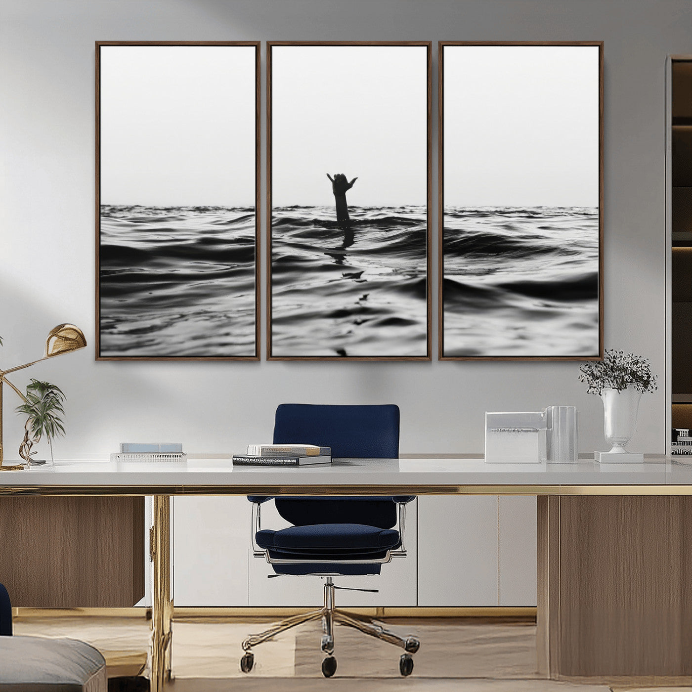 Black and white ocean with a hand making a surfer sign among dark waves, creating a dramatic and minimalist seascape with bold contrast.