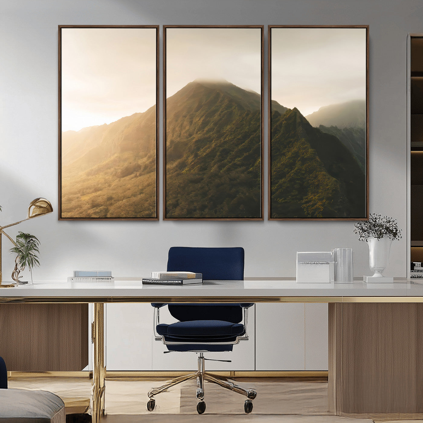 Sunlit mountain peak with mist rolling over its rugged slopes, bathed in golden light, creating a warm and tranquil nature-inspired scene.