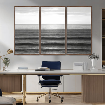 Minimalist black and white ocean view with layered waves reflecting sunlight, evoking a sense of calm and coastal serenity.