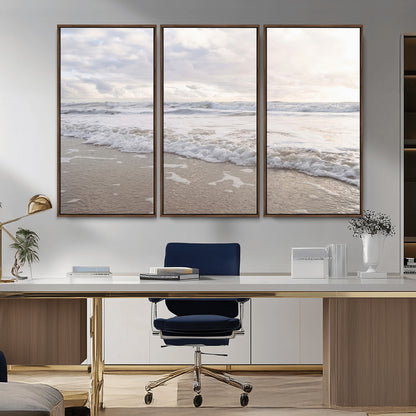 Peaceful ocean waves rolling onto the sandy shore under soft light, perfect for neutral or coastal minimalist decor themes.