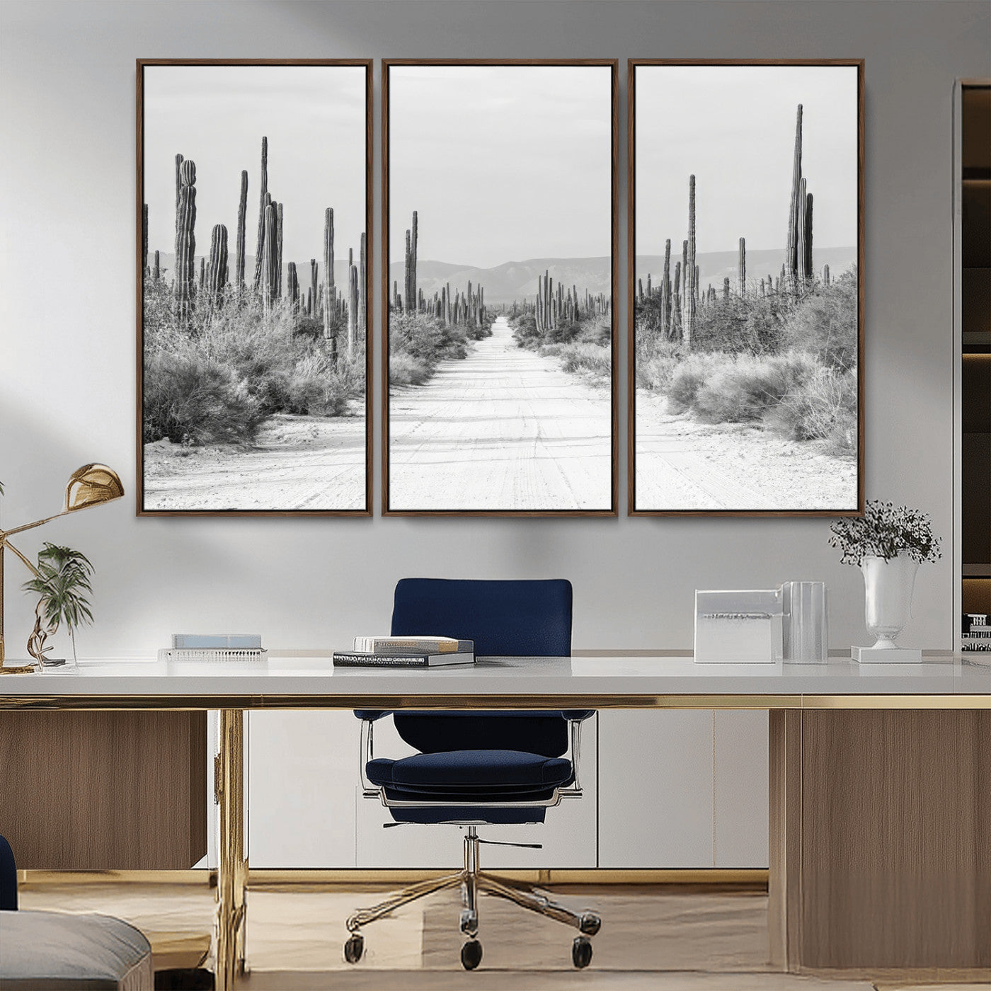 A black and white desert road stretching through a cactus-filled landscape, creating a rugged and timeless southwestern aesthetic with a sense of adventure.