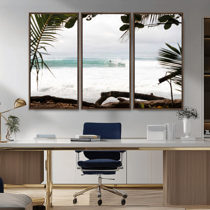 Tropical beach view with palm trees and surfer riding a wave, perfect for boho or coastal-inspired interior wall decor.