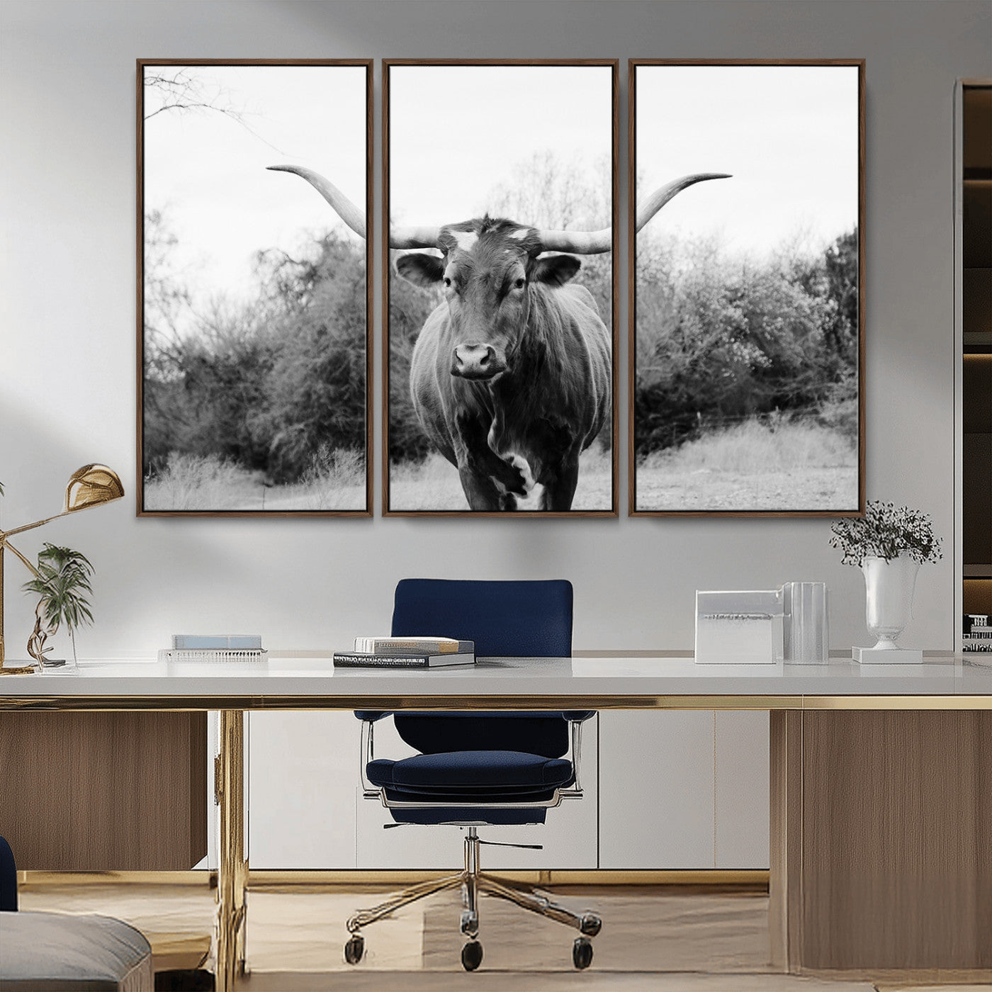 Black and white photo of a longhorn cow in a field, perfect for rustic farmhouse or western-themed interior wall decoration.