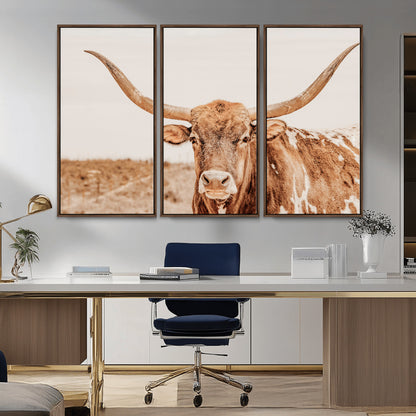 A longhorn bull standing proudly in a sunlit desert field with warm neutral tones, ideal for rustic western or farmhouse interiors.