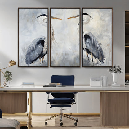 Two herons facing each other on a soft-toned background with blue-grey feathers, perfect for tranquil, coastal or nature-themed interiors.