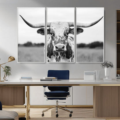 Capture the strength and elegance of nature with this striking black and white portrait of a longhorn cow. Its powerful presence makes a bold statement in any room.