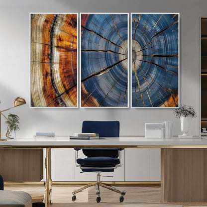 A stunning close-up view of a tree trunk, showcasing the intricate growth rings in a vibrant mix of warm browns, cool blues, and hints of natural texture.