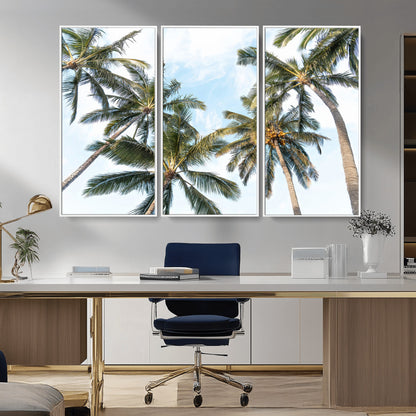 Framed canvas of tall palm trees reaching into a tropical sky, ideal for beach home or relaxed island-inspired wall decor.