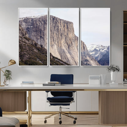 Framed canvas of El Capitan’s vertical granite face in Yosemite with snowy peaks, ideal for Sierra minimalism or mountain-inspired decor.