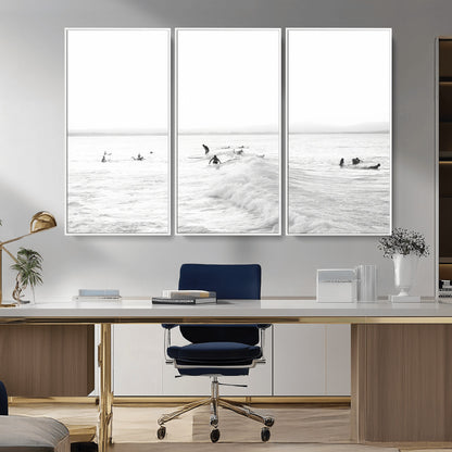Monochrome photo of surfers riding and waiting on ocean waves, ideal for surf-themed or coastal energy wall decor.