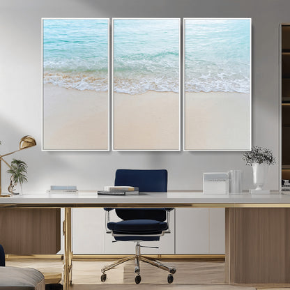 Soft shoreline with gentle aqua waves on smooth sand, ideal for minimalist coastal or pastel ocean-inspired home wall decor.