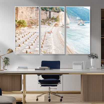 Wall art of a calm Mediterranean beach with rows of sun loungers and umbrellas in soft pastel tones, perfect for light coastal or vacation-themed decor.