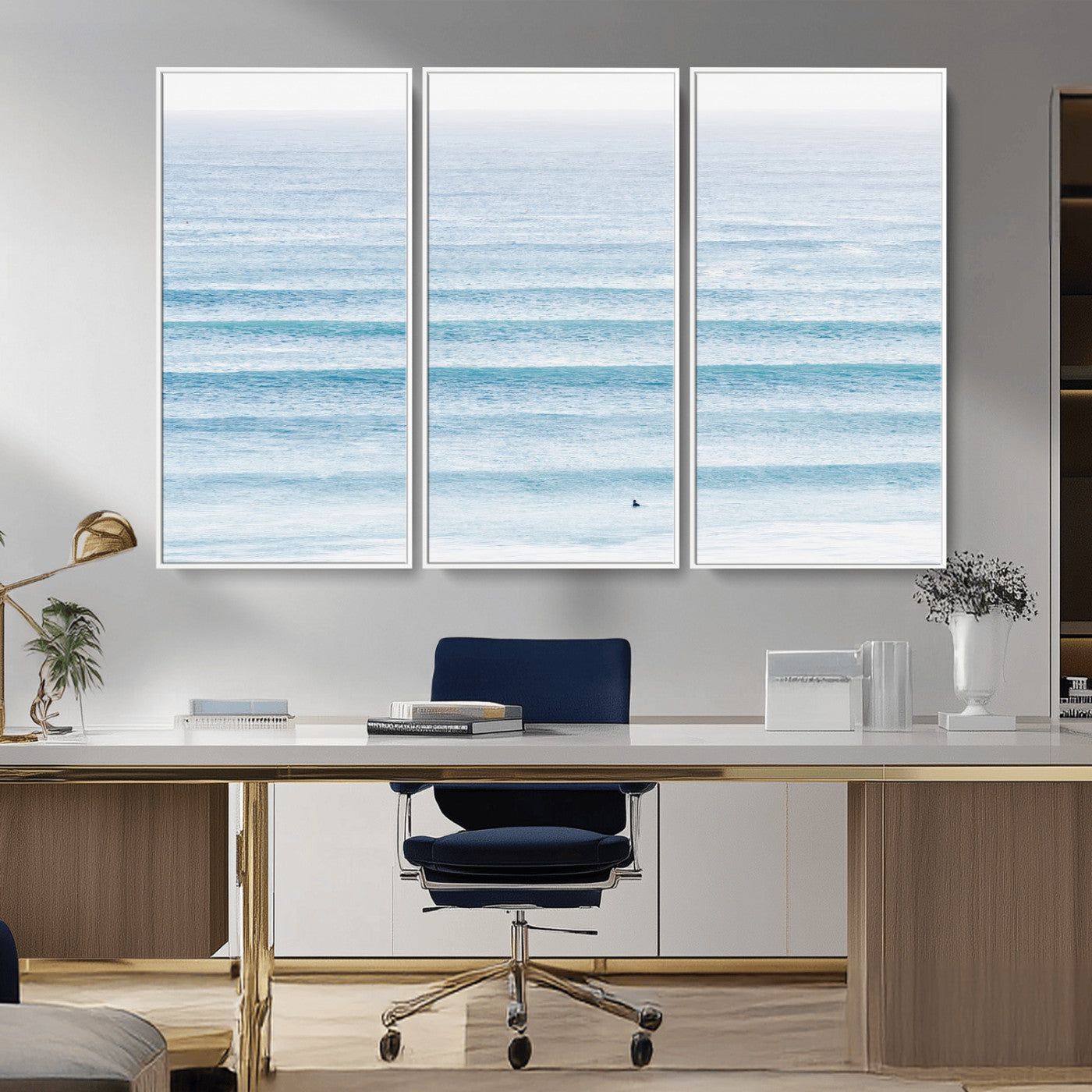 Minimalist ocean view with soft blue waves and a lone surfer, creating a serene and airy coastal aesthetic, perfect for tranquil home decor.