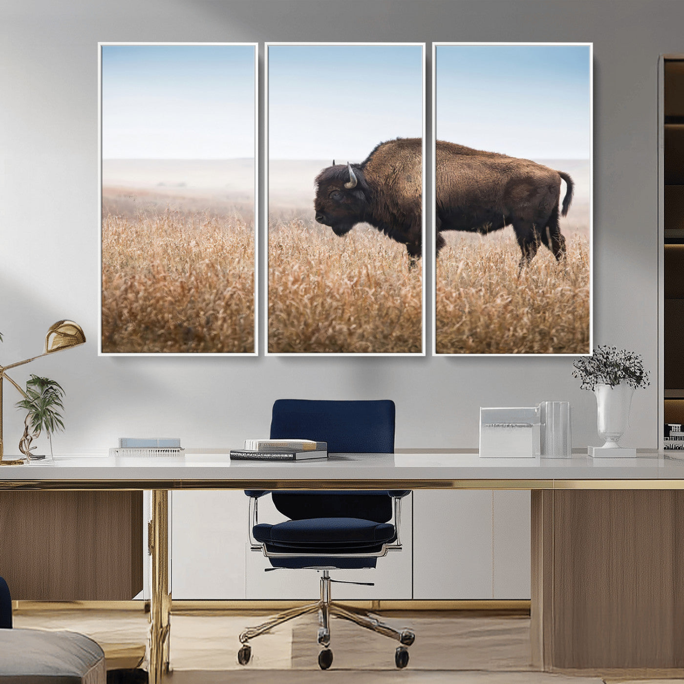 A majestic bison standing in an open prairie field, its strong form blending into the golden grass under a vast blue sky, evoking the wild spirit of the American plains.